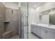 Bathroom with double vanity, walk-in shower, and separate tub at 7788 Richmond Trl, Fairburn, GA 30213