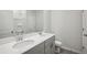 Secondary bathroom with double vanity and toilet at 7788 Richmond Trl, Fairburn, GA 30213