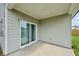 Covered patio with sliding glass door access at 7788 Richmond Trl, Fairburn, GA 30213