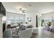 Open concept living and dining area with hardwood floors at 7788 Richmond Trl, Fairburn, GA 30213