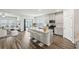 Modern kitchen with island and stainless steel appliances at 7788 Richmond Trl, Fairburn, GA 30213