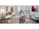 Home office with a large desk and comfortable seating at 7788 Richmond Trl, Fairburn, GA 30213