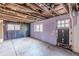 Unfinished basement with exterior access and painted walls at 143 Longview Rd, Fayetteville, GA 30214