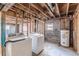 Unfinished basement with washer and dryer hookups, plumbing, and electrical at 143 Longview Rd, Fayetteville, GA 30214