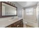 Updated bathroom with dark vanity and a bathtub at 143 Longview Rd, Fayetteville, GA 30214