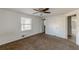 Well-lit bedroom, featuring a ceiling fan and two closets at 143 Longview Rd, Fayetteville, GA 30214