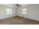 Spacious bedroom with neutral carpeting and two windows at 143 Longview Rd, Fayetteville, GA 30214