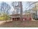Ranch-style home with a screened porch and wooded backyard at 143 Longview Rd, Fayetteville, GA 30214