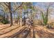 Brick house with attached carport and a partially wooded lot at 143 Longview Rd, Fayetteville, GA 30214