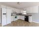 Galley kitchen with white cabinets and black appliances at 143 Longview Rd, Fayetteville, GA 30214
