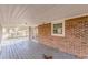Screened porch features a brick wall and wooden deck at 143 Longview Rd, Fayetteville, GA 30214