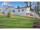 Landscaped backyard showcasing a well-manicured lawn and the home's exterior at 3251 Stoney Acres Nw Dr, Kennesaw, GA 30152