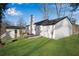 Backyard view featuring well-kept lawn and home's exterior at 3251 Stoney Acres Nw Dr, Kennesaw, GA 30152