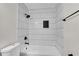 Modern bathroom featuring subway tile shower and black hardware at 3251 Stoney Acres Nw Dr, Kennesaw, GA 30152