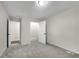 Bedroom featuring neutral carpet, white walls, and walk-in closet at 3251 Stoney Acres Nw Dr, Kennesaw, GA 30152
