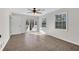 This light-filled bedroom has neutral paint, large windows, and a sliding glass door to the back porch at 3251 Stoney Acres Nw Dr, Kennesaw, GA 30152