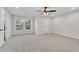 Bright bedroom with carpeted floors, a ceiling fan, and a scenic view from the windows at 3251 Stoney Acres Nw Dr, Kennesaw, GA 30152
