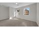 This light-filled bedroom has neutral paint and carpet at 3251 Stoney Acres Nw Dr, Kennesaw, GA 30152