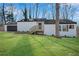 Beautiful single-story home boasts a well-manicured lawn, stylish shutters, and inviting entrance at 3251 Stoney Acres Nw Dr, Kennesaw, GA 30152