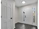 Bright foyer with tiled floors, a view of the neighborhood, and a crisp, clean finish at 3251 Stoney Acres Nw Dr, Kennesaw, GA 30152