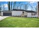 Charming ranch-style home with a well-maintained lawn and a detached garage at 3251 Stoney Acres Nw Dr, Kennesaw, GA 30152