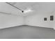 Clean, empty garage featuring an automatic door and white walls at 3251 Stoney Acres Nw Dr, Kennesaw, GA 30152