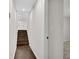 Hallway with hardwood floors and stairs leading to the upper level at 3251 Stoney Acres Nw Dr, Kennesaw, GA 30152