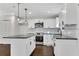 Updated kitchen with white cabinets, stainless steel appliances, and dark countertops at 3251 Stoney Acres Nw Dr, Kennesaw, GA 30152