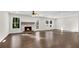 Spacious living room with hardwood floors and a stone fireplace at 3251 Stoney Acres Nw Dr, Kennesaw, GA 30152