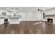 Spacious open-concept living area, with a modern kitchen and a cozy fireplace at 3251 Stoney Acres Nw Dr, Kennesaw, GA 30152