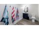 Clean bathroom with a shower, toilet and vanity with a modern countertop at 4973 Concert Ln, Marietta, GA 30066