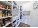 Modern kitchen with blue island, white cabinets, and stainless steel appliances at 4973 Concert Ln, Marietta, GA 30066