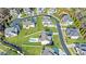 Aerial view of a neighborhood showcasing large, well-maintained homes and verdant lawns with a swimming pool at 4973 Concert Ln, Marietta, GA 30066