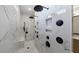 Luxurious shower featuring a rainfall shower head, handheld sprayer, bench, and built-in shelving at 4973 Concert Ln, Marietta, GA 30066