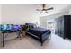 Bedroom with black furnishings, two computer monitors, and a dark wood wardrobe, providing a modern and functional space at 4973 Concert Ln, Marietta, GA 30066