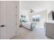 Bright bedroom features neutral carpet, a ceiling fan, and light blue decor and furnishings at 4973 Concert Ln, Marietta, GA 30066