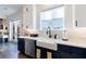 Modern kitchen with white cabinets, a farmhouse sink, and a window overlooking the outdoors, creating a bright and welcoming space at 4973 Concert Ln, Marietta, GA 30066
