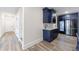Kitchenette features stylish blue cabinetry, a microwave, a sink, and a stainless steel refrigerator at 4973 Concert Ln, Marietta, GA 30066