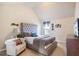 Main bedroom with tufted headboard, chair, and plenty of space at 709 Chapman St, Jonesboro, GA 30238