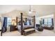 Spacious main bedroom with a large four-poster bed and sitting area at 709 Chapman St, Jonesboro, GA 30238
