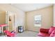Bright bedroom with a red couch and plenty of space for toys at 709 Chapman St, Jonesboro, GA 30238