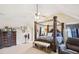 Spacious main bedroom with a large four-poster bed and sitting area at 709 Chapman St, Jonesboro, GA 30238