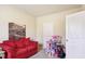 Cozy bedroom featuring a red couch and playful decor at 709 Chapman St, Jonesboro, GA 30238