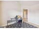 Bedroom with patterned carpet, desk and view into hallway at 709 Chapman St, Jonesboro, GA 30238