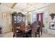 Formal dining room with large table, hutch, and chair set at 709 Chapman St, Jonesboro, GA 30238