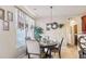 Bright dining room with a round table and four chairs, near kitchen at 709 Chapman St, Jonesboro, GA 30238