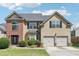 Two story home with large yard and two car garage at 709 Chapman St, Jonesboro, GA 30238