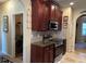 Kitchen with stainless steel appliances and dark wood cabinets at 709 Chapman St, Jonesboro, GA 30238