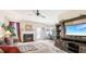 Spacious living room with fireplace, sectional sofa, and large TV at 709 Chapman St, Jonesboro, GA 30238
