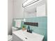 Bathroom with modern fixtures, a sleek sink, and colorful tile work, creating a stylish space at 1120 Starline Se Dr, Smyrna, GA 30080